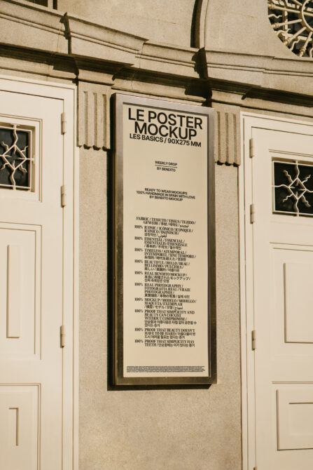 Cream-colored poster mounted on stone facade with fabric content specifications listed