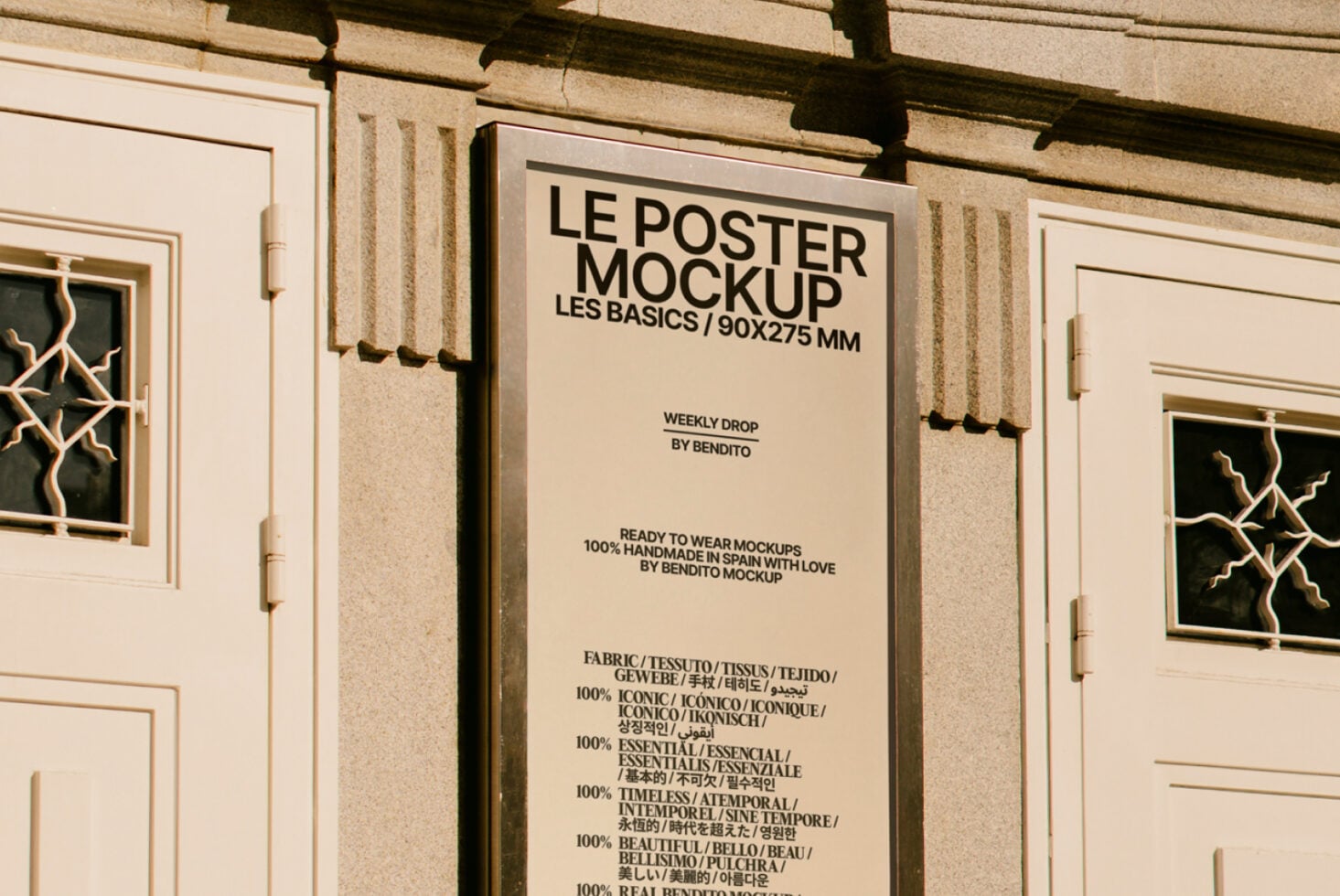 Cream poster on beige building wall showing typography layout with multilingual text