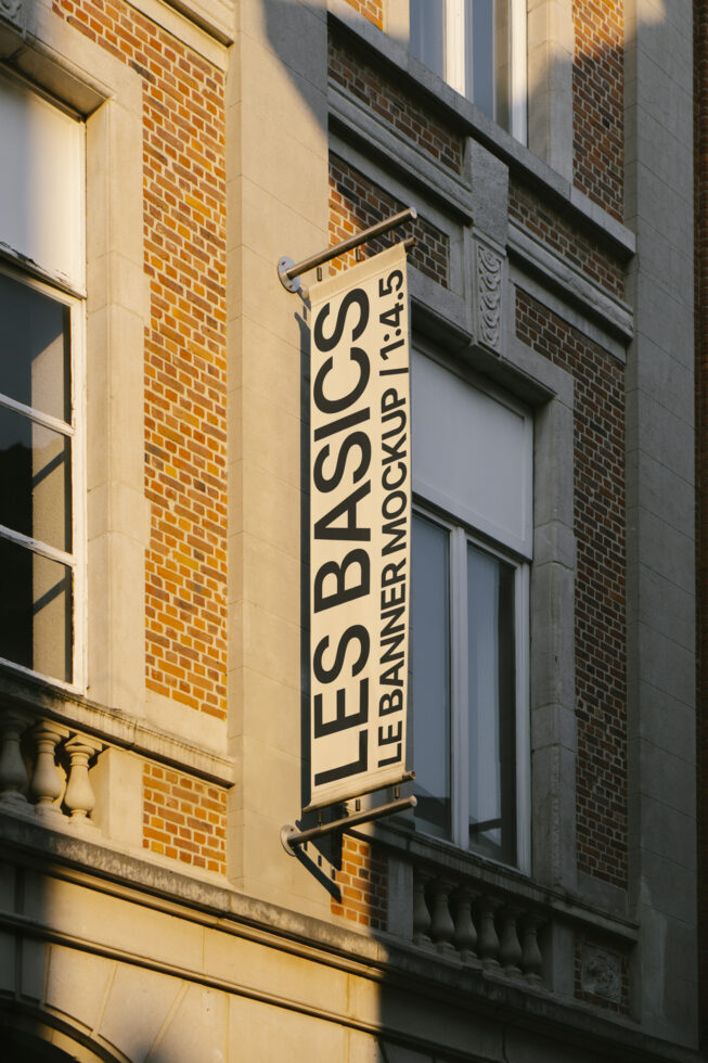 Street hanging banner mockup on urban building facade with cream background