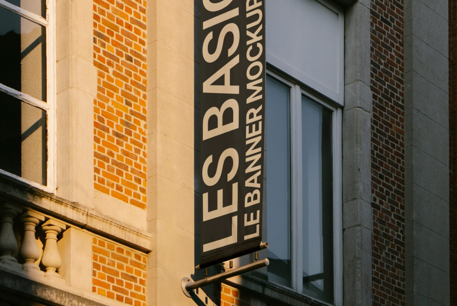 Zoomed detail of vertical signage mockup on brick exterior wall