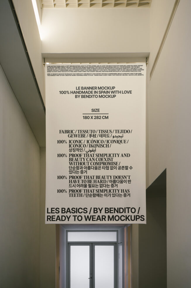 Large mockup banner in a hallway with multilingual text about handcrafted design. Keywords: mockup, banner, design, handmade, typography, simplicity.