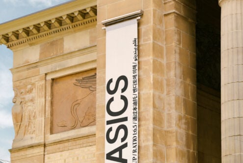 Building facade banner mockup with diverse languages, classic architecture, ideal for designers. Keywords: mockup, architecture, design, banner.