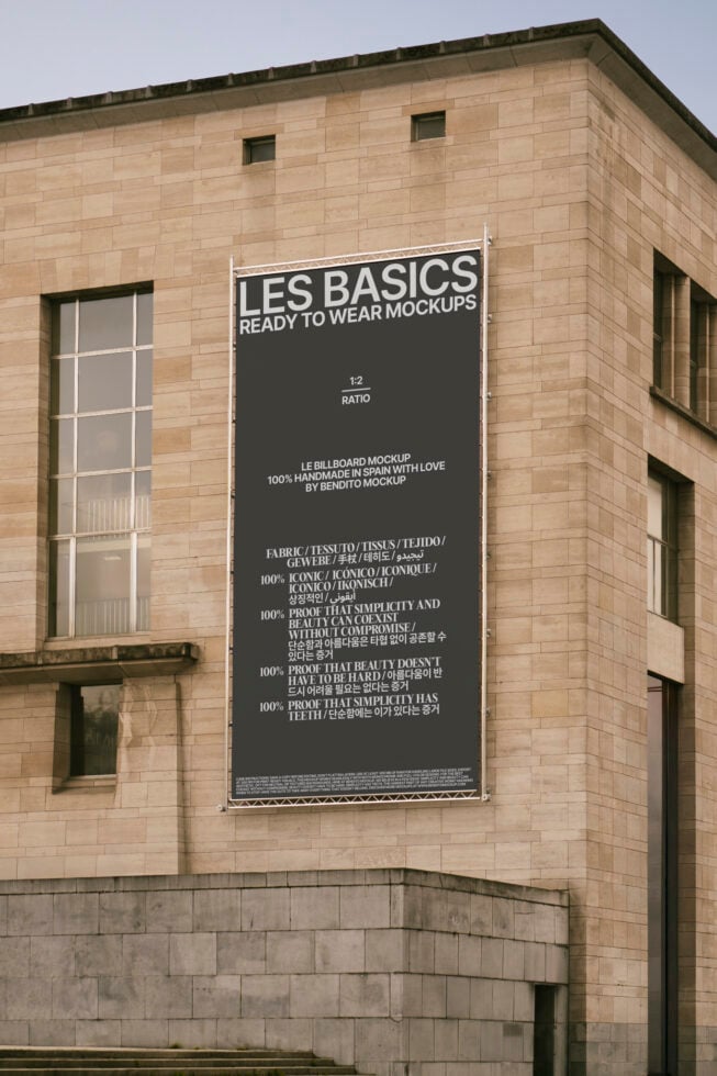 Large urban fabric billboard mockup on stone building displaying modern typographic design for designers. Ideal for template and graphics projects.