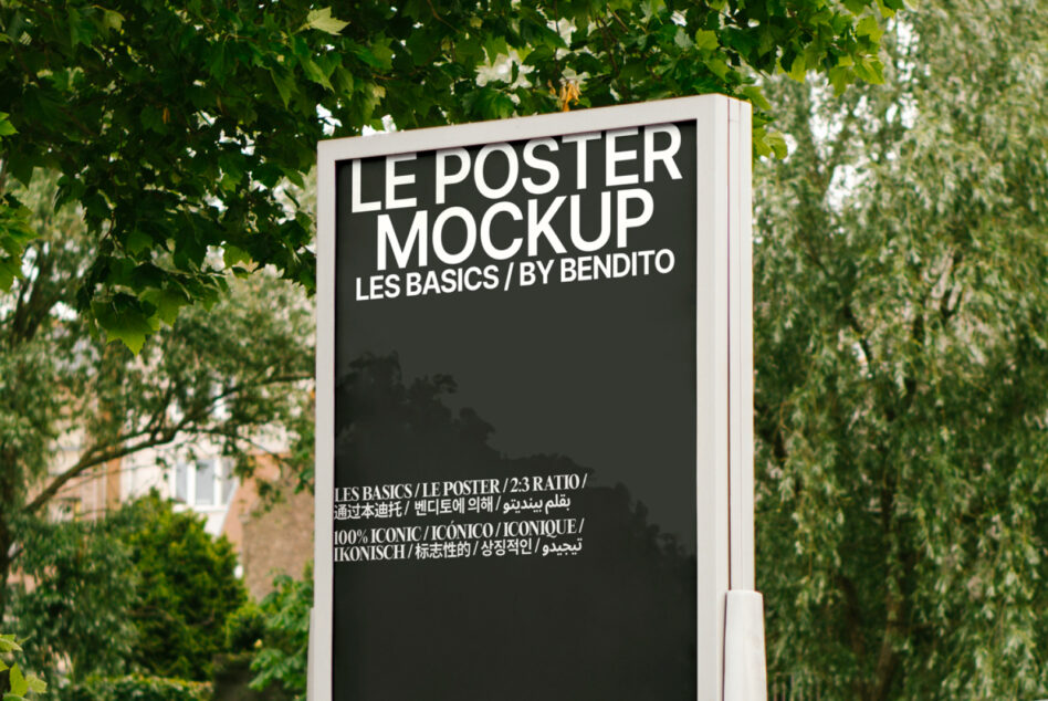 Black poster display on white mounted stand with weeping willow branches overhead