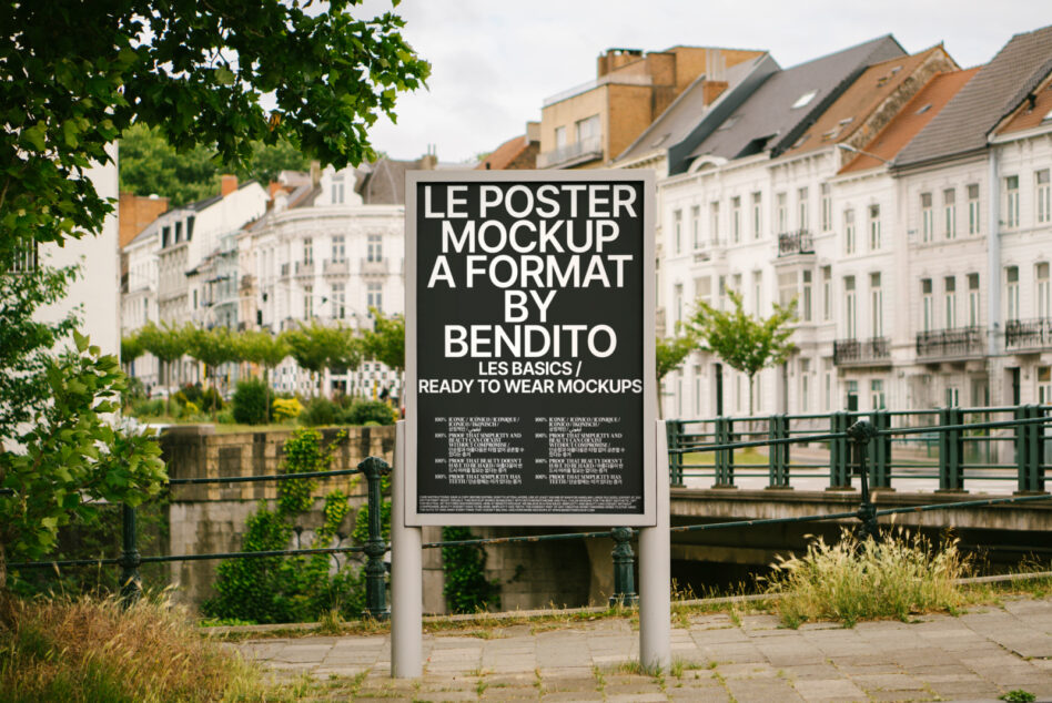 Black outdoor poster display mounted on white post with classical architecture backdrop