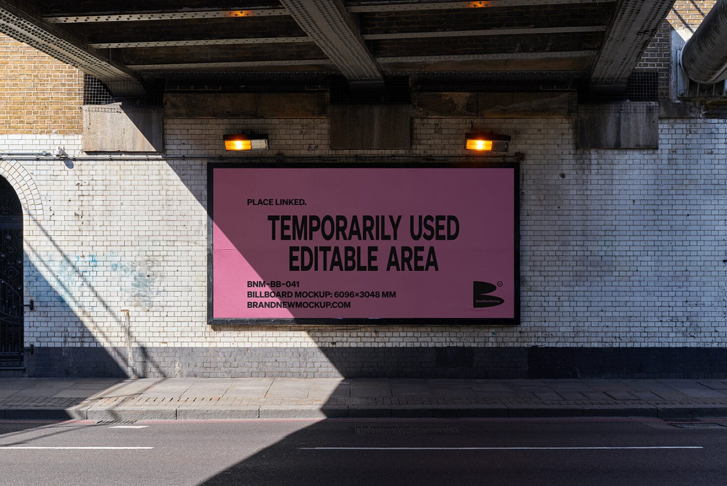 Horizontal billboard mockup with pink background on brick underpass streetscape