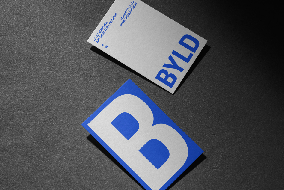 Blue BYLD branding with rounded B logo on business card mockup