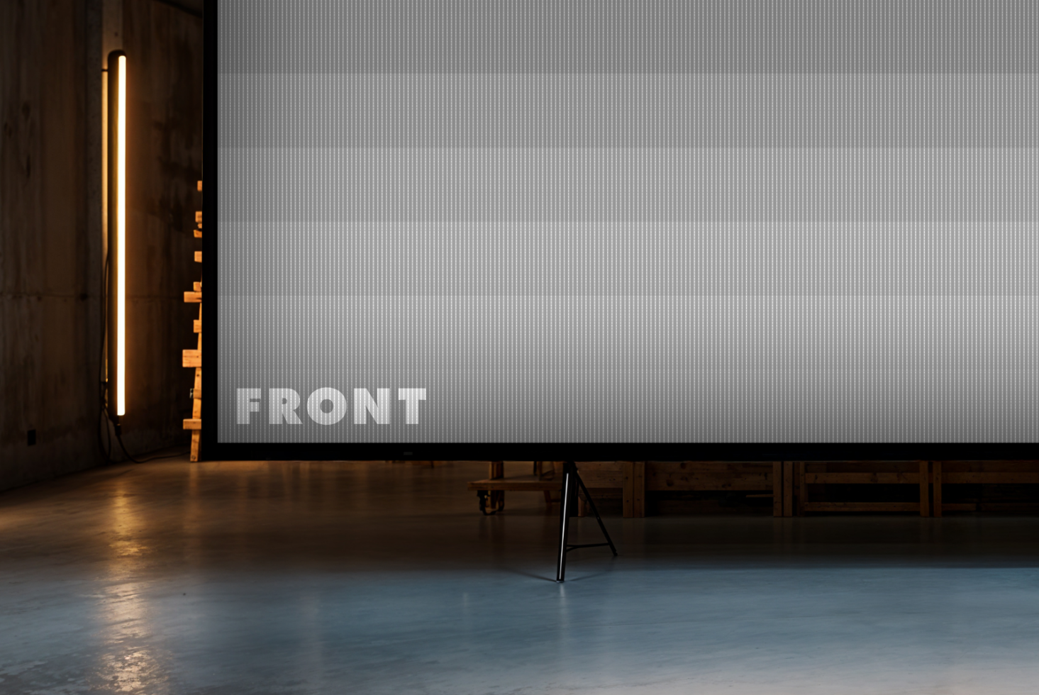 Large blank screen mockup in a modern industrial space. Ideal for presentations or design showcase. Keywords: mockup, industrial, screen, presentation.