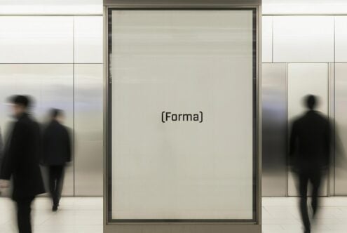 Mockup of a blank advertising panel in a modern subway station with blurred commuters walking by ideal for realistic billboard or signage presentations.