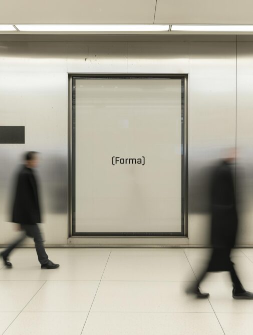 Mockup of an empty poster frame on a subway wall with blurred pedestrians walking by ideal for showcasing fonts and graphics to designers