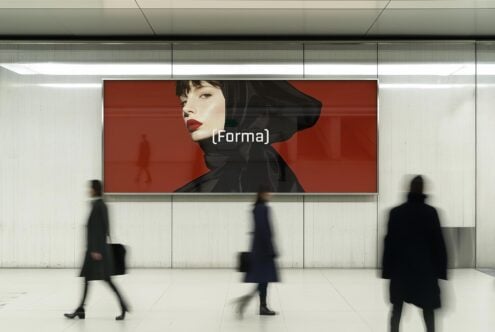 Urban billboard mockup with fashion design featuring a model in black and red clothing. Ideal for designers' projects. Keywords: mockup, fashion, billboard.