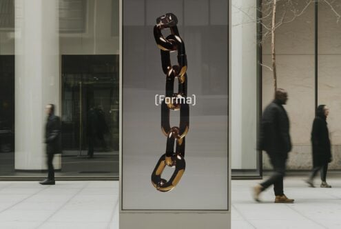 Chain sculpture displayed in a modern urban setting with blurred pedestrians walking by. Perfect for designers seeking high-quality mockup graphics.