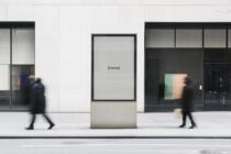 Urban street billboard mockup with pedestrians blurred in motion. Ideal for presenting ad designs or creative visual content. City setting for designers.