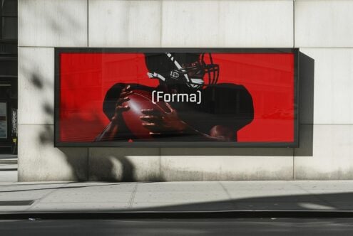 Red mockup billboard with athlete holding a football wearing a helmet. Perfect for urban design projects, sports events, advertising. Ideal for designers.