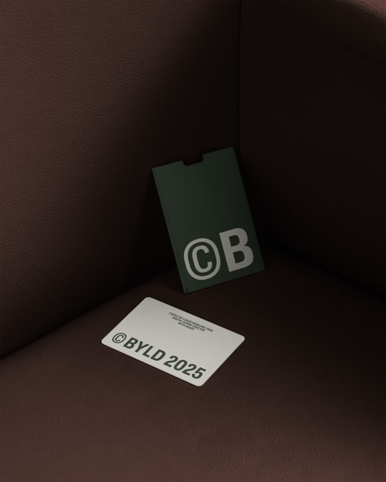 Dark green cigarette pack mockup with business card on brown leather backdrop