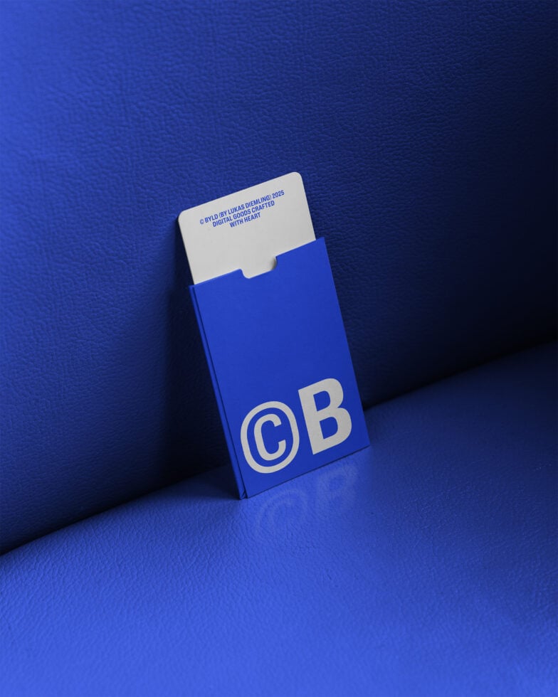 Blue cigarette box mockup with CB logo resting on blue textured surface