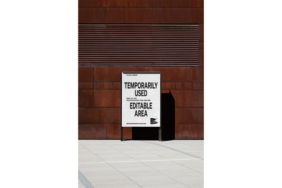 Street level poster mockup on rusted metal exterior with concrete floor