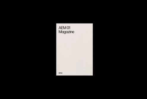 Minimalist magazine cover mockup with black text on white background for AEM 01. Ideal for graphic designers and branding, perfect for showcasing templates.