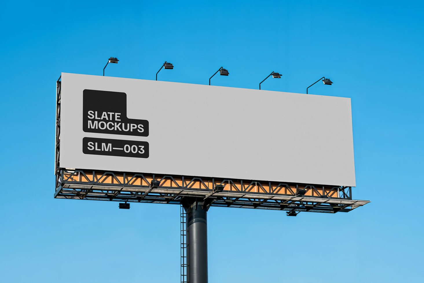 Large billboard mockup with a blank design against a clear blue sky. Ideal for showcasing advertising graphics. Perfect for digital designers.
