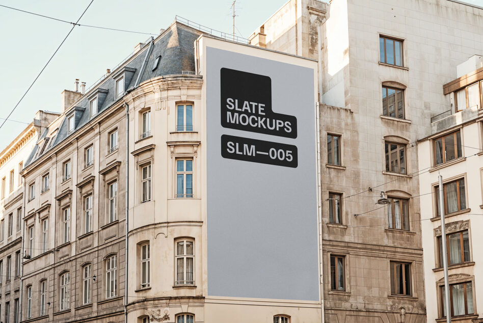 Vertical billboard mockup on modern building between classical architecture
