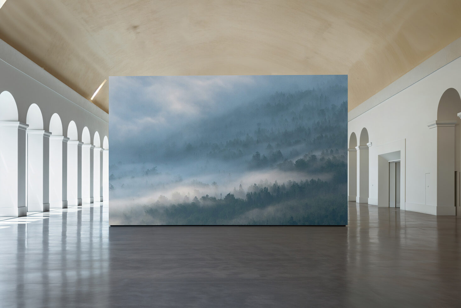Horizontal print mockup in modern gallery space with arched columns