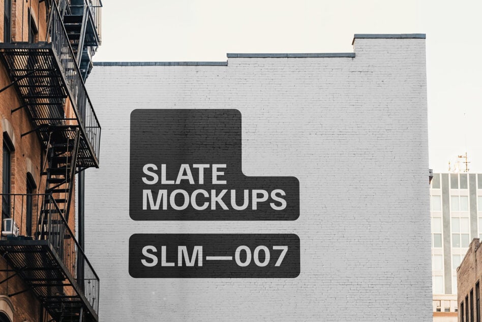 Urban brick wall mockup with white text reading slate mockups slm-007