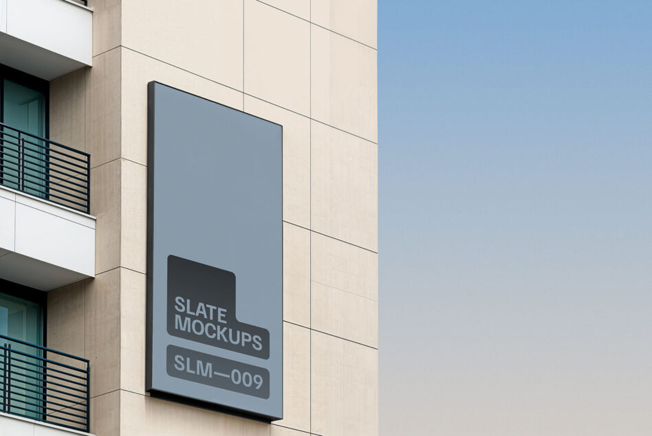 Building exterior showing slate blue vertical sign mockup on cream panel wall