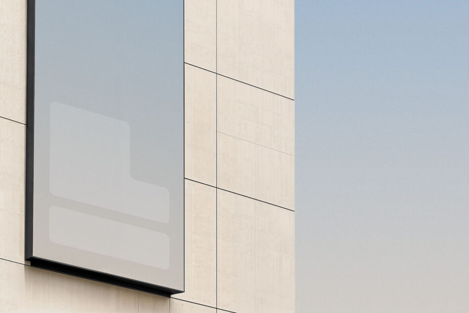 Modern building facade with large rectangular window display mockup on beige stone