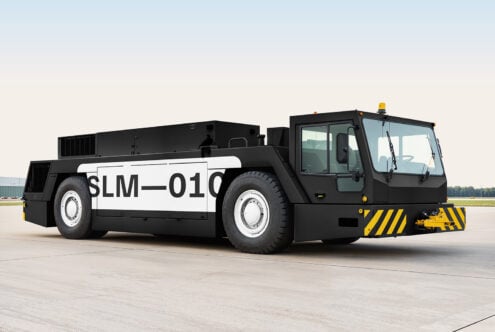 Airport vehicle on tarmac for digital mockup. Large black and white ground support equipment, perfect for designers needing aviation-related graphics.