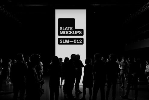 Silhouettes of people in a dark room with a large illuminated display reading Slate Mockups SLM-012 perfect for designers seeking digital mockup templates.