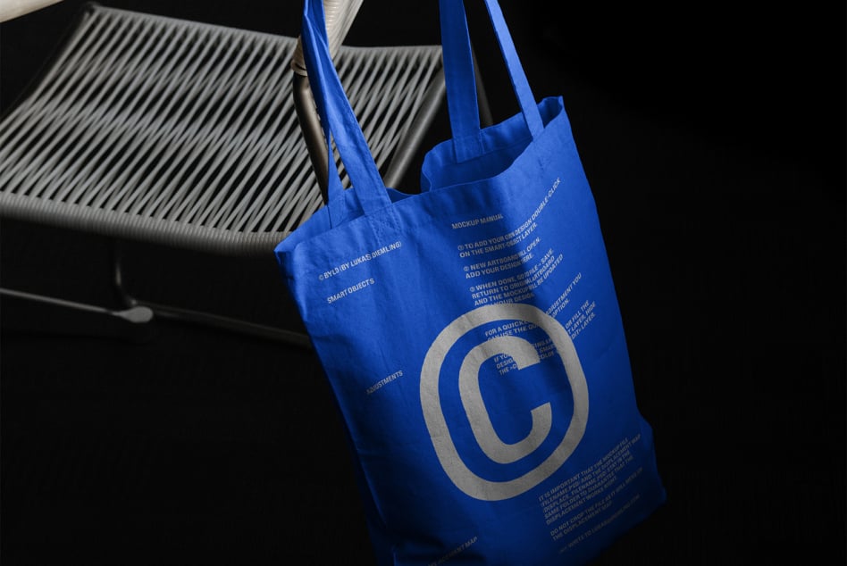 Blue tote with silver copyright mark, instructions printed inside