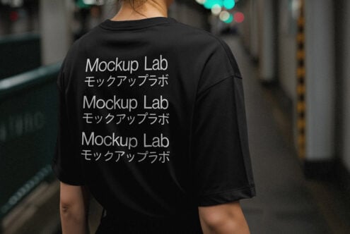 Back of a black t-shirt featuring Mockup Lab text in English and Japanese. Ideal for apparel mockup designs in urban settings for creative designers.