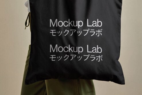 Black tote bag with Japanese text and Mockup Lab branding ideal for designers seeking mockup templates apparel design or product presentation assets.