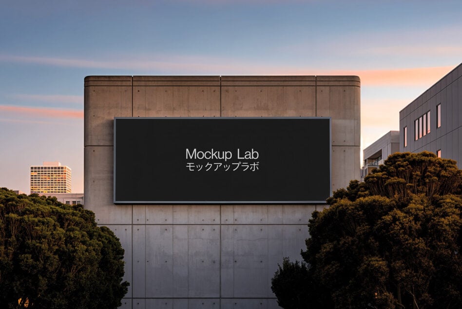Dark billboard on brutalist concrete building overlooking city at dusk
