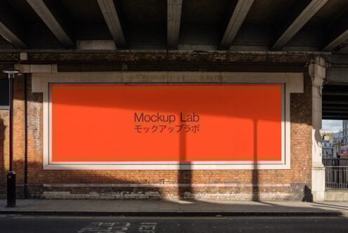 Red billboard mockup under an urban bridge perfect for showcasing ads or designs for creatives and designers. Ideal for branding presentation.