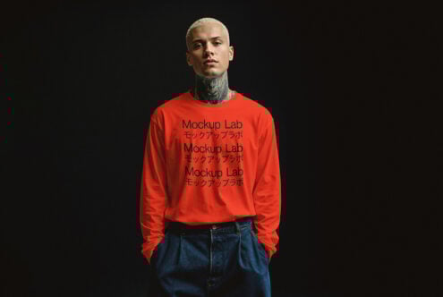 Man wearing red sweatshirt mockup featuring Mockup Lab text in English and Japanese on black background suitable for designers and graphic design projects