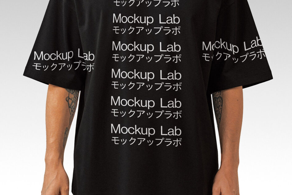 Black oversized tee with repeated white Mockup Lab text in English plus Japanese characters
