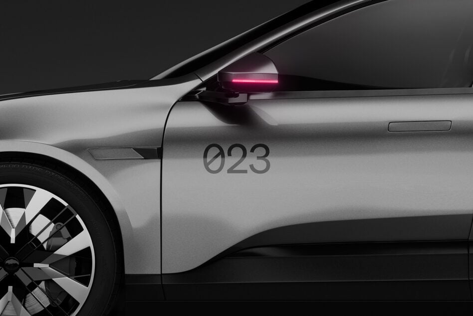 Silver car side view with pink neon mirror, 023 model number on body