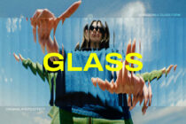 Person with sunglasses surrounded by flowers with yellow GLASS text overlay
