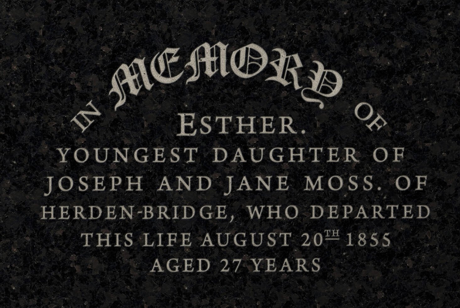 Stone memorial plaque displaying engraved text for Esther with ornate fonts. Ideal for designers seeking historical typography or vintage memorial designs.