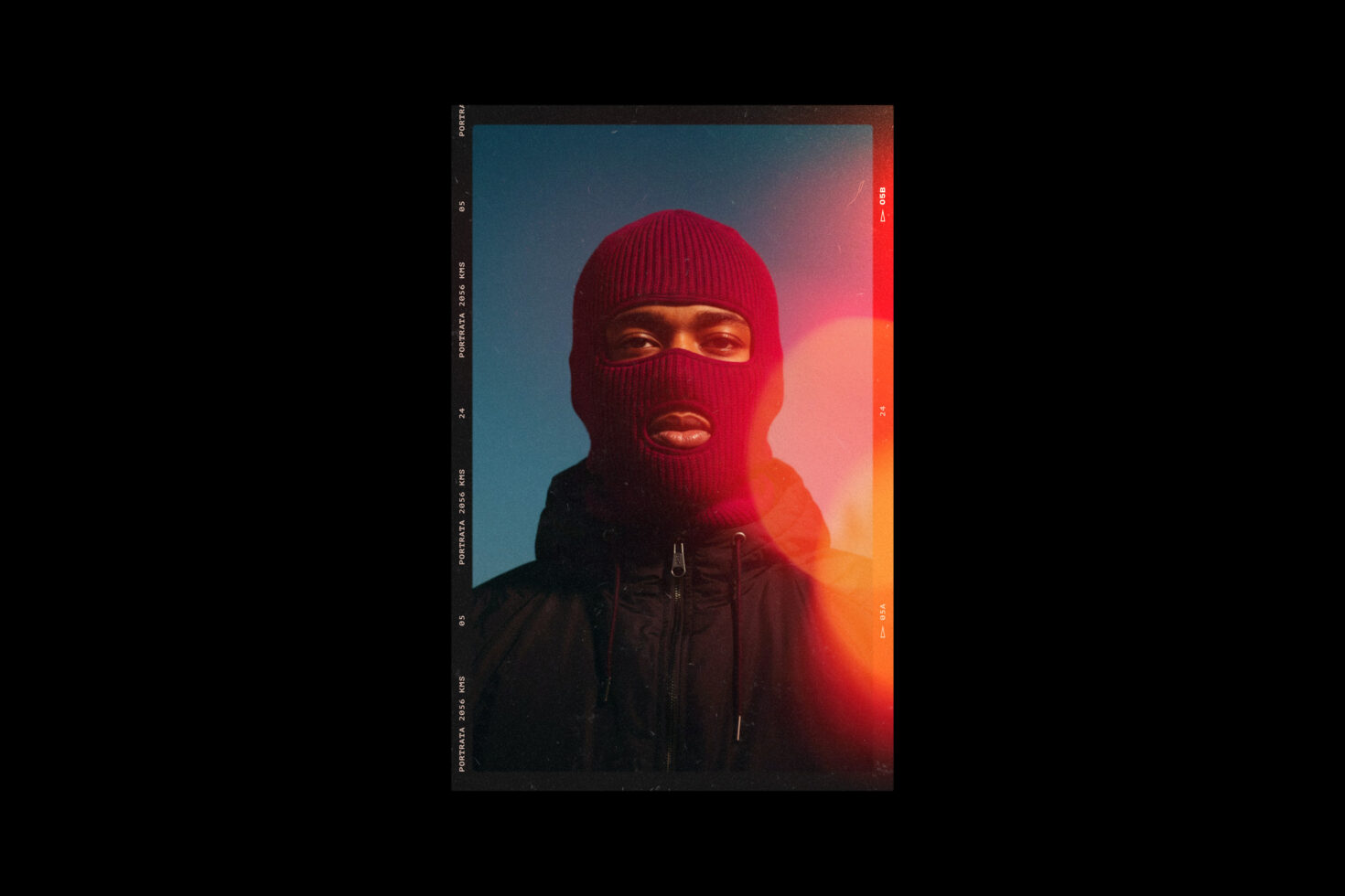 Portrait of a person in a red ski mask with artistic light effects. Suitable for graphic design projects. Keywords: portrait design art photography.