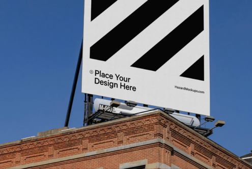 Outdoor billboard mockup over brick building with blue sky background, perfect for showcasing graphic designs. Editable template for designers.