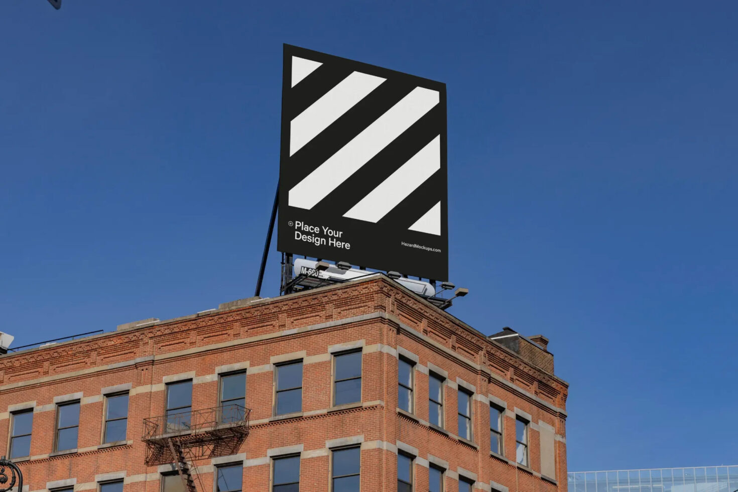Urban billboard mockup atop a brick building under clear skies. Ideal for showcasing outdoor advertising designs. Perfect for marketing presentations.