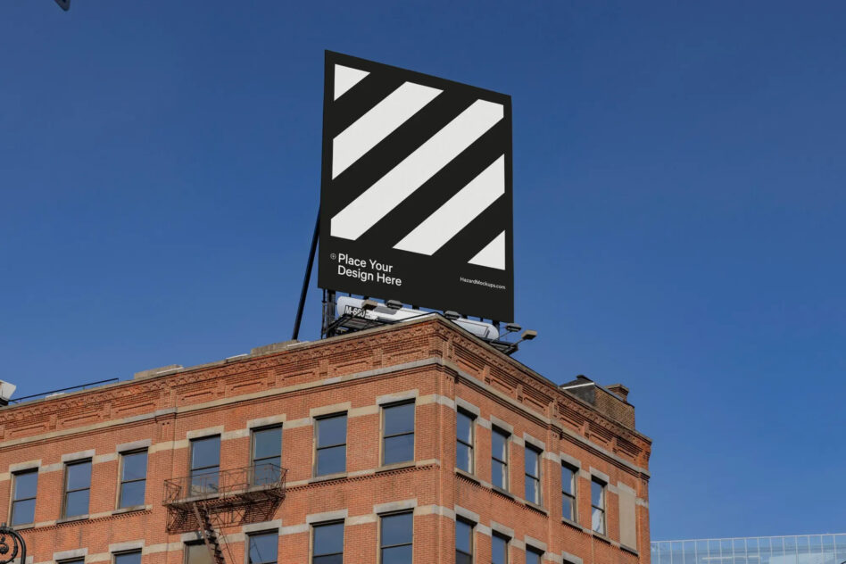 Urban billboard mockup atop a brick building under clear skies. Ideal for showcasing outdoor advertising designs. Perfect for marketing presentations.