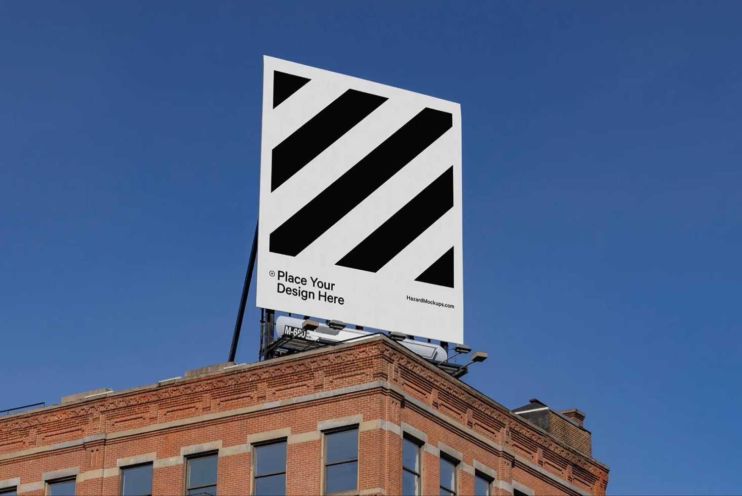 Large billboard mockup on a rooftop building under a clear blue sky. Ideal for designers showcasing outdoor advertising, graphics, urban marketing.