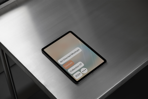 Tablet on a metal surface displaying digital mockup interface Art Directed Mockups Devices Collection 07 2024 Ideal for graphic designers