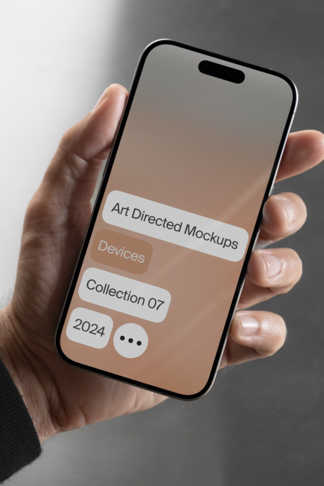 Hand holds smartphone displaying art-directed mockups interface screen. Keywords devices collection 2024. Ideal for designers seeking high-quality mockups.