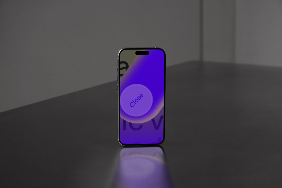 iPhone displaying vibrant purple gradient screen with Close button in center circle on reflective surface