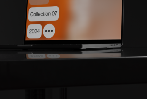 Laptop screen mockup displaying a minimalist interface with Collection 07 and 2024 text. Ideal for designers seeking sleek presentation templates.