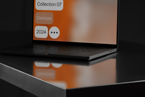 Sleek laptop mockup on a reflective surface with abstract orange display Perfect for showcasing digital design assets Modern tech aesthetic 2024 trends